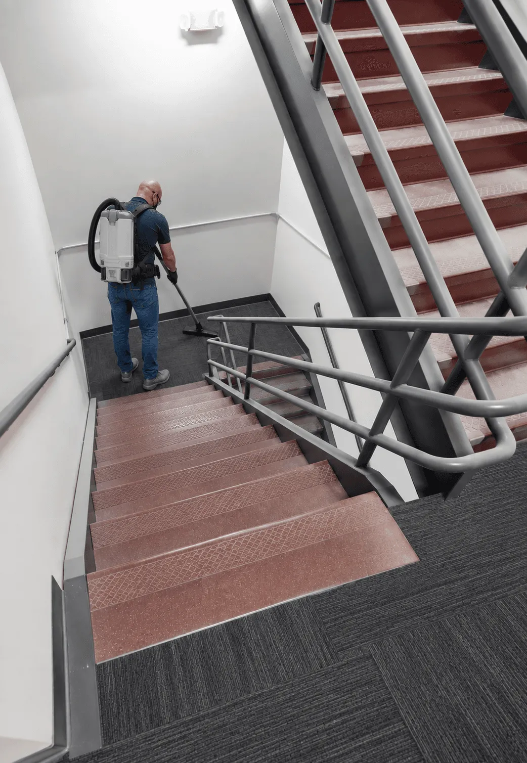 Janitorial cleaning crew servicing a Portland building hallway